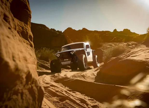 A Vanderhall Brawley navigating a sunlit sandstone trail